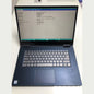 Laptop with a command line interface on the screen, placed on a white surface.